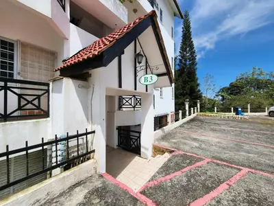 a building with a sign on the side of it at Little England B3 in Bukit Fraser