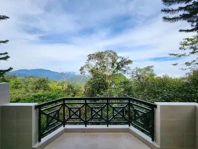 a balcony with a view of the mountains at Little England B3 in Bukit Fraser