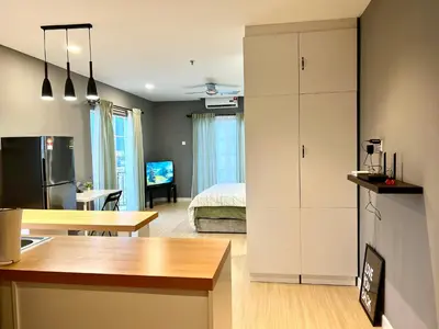 a kitchen and a living room with a bedroom at High floor Mountain view Kampar in Kampar
