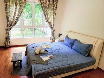 a bedroom with a bed with a teddy bear on it at The Ipoh All Suite Resort, Jalan Haven Ipoh in Ipoh