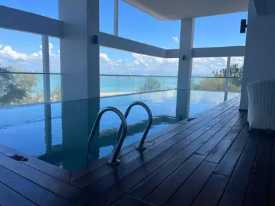 a room with a view of the water in a house at Sunrise@Gurney Spacious 2BR Duplex in George Town