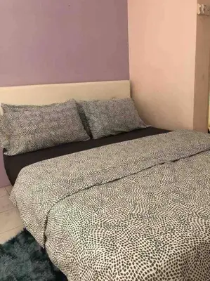 a bedroom with a bed with two pillows on it at SUPER COMFY HOME @ KULIM CITY in Kulim