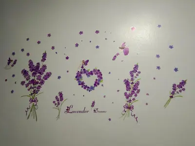 a bunch of purple flowers on a wall with confetti at QQ Homestay in Ipoh