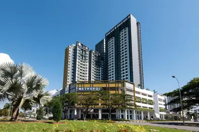 a large office building with palm trees in front of it at METROPOL SERVICED APARTMENT at Bukit Mertajam, Pulau Pinang in Bukit Mertajam