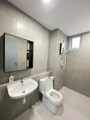a bathroom with a white toilet and a sink at METROPOL SERVICED APARTMENT at Bukit Mertajam, Pulau Pinang in Bukit Mertajam
