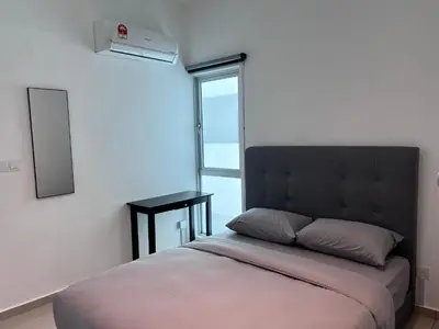 a bedroom with a bed with a large window at METROPOL SERVICED APARTMENT at Bukit Mertajam, Pulau Pinang in Bukit Mertajam