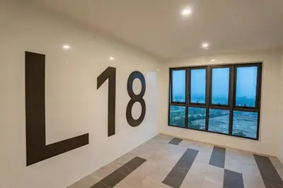 a room with a number on the wall at Ipoh Tambun Lost World Sunway Onsen Suites Lana 2R2B 8 paxs in Tambun