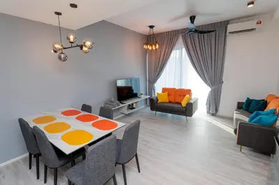 a dining room with a table and chairs at Ipoh Tambun Lost World Sunway Onsen Suites Lana 2R2B 8 paxs in Tambun