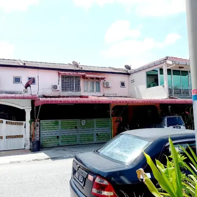 a car parked in front of a house at Nur's Homestay in Seri Manjung