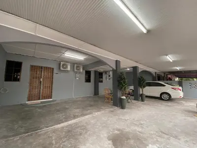 a parking lot with a car parked in a garage at Venice Guest Hostel - Bilik Sahaja in Lumut