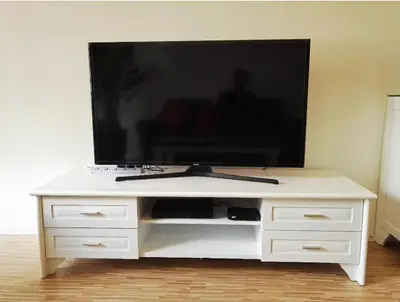 a white entertainment center with a flat screen tv on it at Cameron Lovely Home 3 Rooms in Tanah Rata