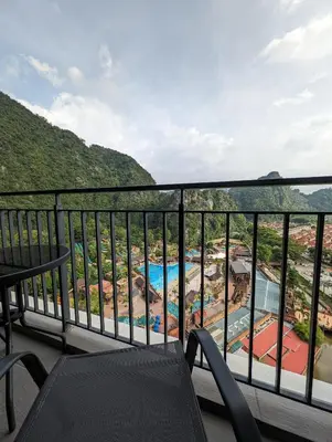 a balcony with a view of a resort at Amazing Views & Eco Friendly Luxury Onsen Suites, Lost World of Tambun in Ipoh