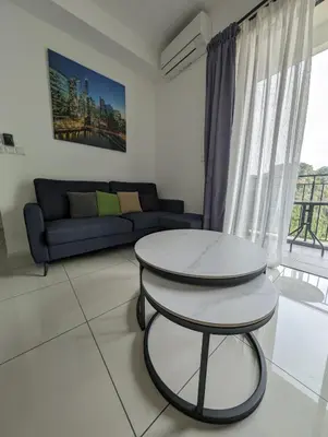 a living room with a table and a couch at Amazing Views & Eco Friendly Luxury Onsen Suites, Lost World of Tambun in Ipoh