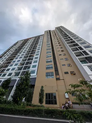 a tall building with people standing on the side of it at Amazing Views & Eco Friendly Luxury Onsen Suites, Lost World of Tambun in Ipoh