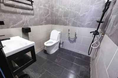 a bathroom with a toilet and a sink at monstera homestay near Tambun, Ipoh Garden East in Ipoh