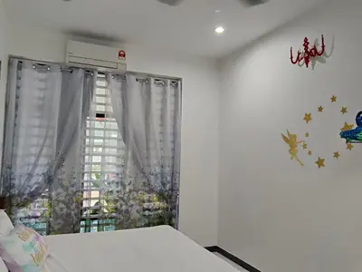 a bedroom with a bed and a window with curtains at Sweet 3 bedroom home @ Canning Garden, Ipoh in Ipoh