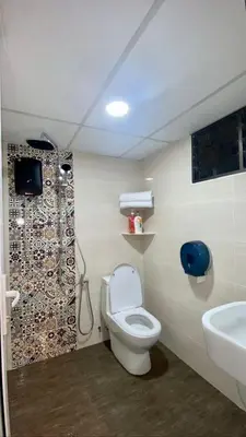 a bathroom with a toilet and a sink at The Ferringhi Sea View 777 in Batu Ferringhi