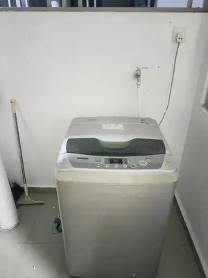 a toilet in a room with a white wall at Starlight Homestay The Venus Sitiawan in Seri Manjung