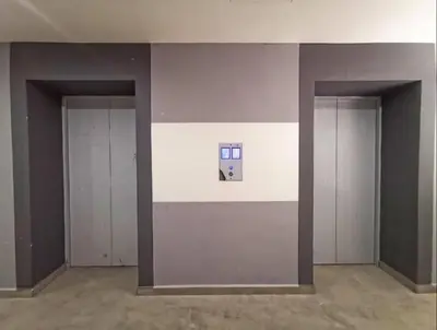 an empty room with two doors and a picture on the wall at Starlight Homestay The Venus Sitiawan in Seri Manjung