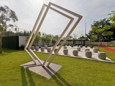 a metal sculpture in a field with grass at Starlight Homestay The Venus Sitiawan in Seri Manjung