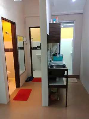 a small bathroom with a sink and a mirror at 1 MINUTES TO TOWER SENTRAL INTAN HOMESTAY 6 ROOMS in Teluk Intan