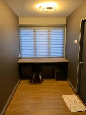 a room with a window with a desk and a table at Ulike homestay~3room~The Venus~Manjung~Lumut in Seri Manjung