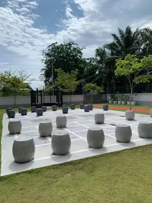 a sculpture of stone spheres on a grass field at Ulike homestay~3room~The Venus~Manjung~Lumut in Seri Manjung
