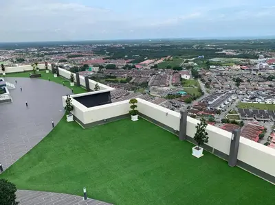 an aerial view of a building with a green lawn at Ulike homestay~3room~The Venus~Manjung~Lumut in Seri Manjung