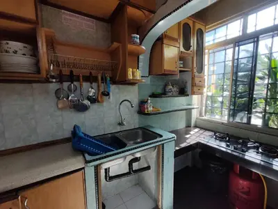a small kitchen with a sink and a window at ZE II Homestay_Cameron in Tanah Rata