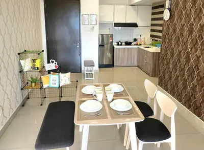 a kitchen with a wooden table and chairs and a table and chairsktop at IPOH CITY CENTRE Majestic Homestay Pool View 3 mins Walking to Famous Food Places & 15mins to Old Town Ipoh by Happy Homestay in Ipoh