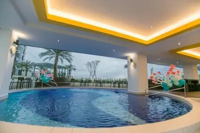 a large swimming pool in a house with a large pool at IPOH CITY CENTRE Majestic Homestay Pool View 3 mins Walking to Famous Food Places & 15mins to Old Town Ipoh by Happy Homestay in Ipoh