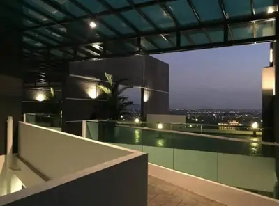 a building with a view of a city at night at IPOH CITY CENTRE Majestic Homestay Pool View 3 mins Walking to Famous Food Places & 15mins to Old Town Ipoh by Happy Homestay in Ipoh