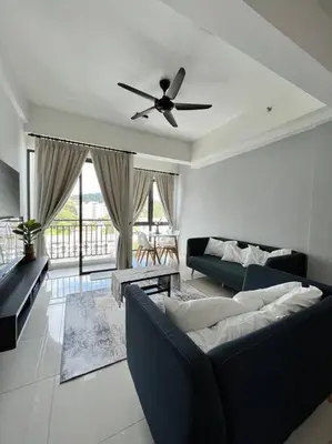 a living room with a couch and a ceiling fan at Lily Ville in Tanah Rata