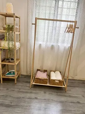 a room with a swing with baskets and a window at Roemah lily studio in Tanah Rata