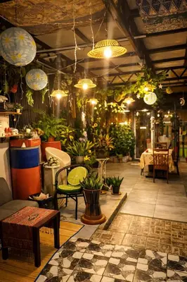 a room filled with lots of potted plants at SABAYA HOMESTAY in Balik Pulau