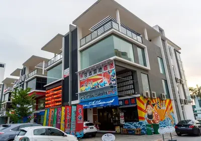 a building with cars parked in front of it at 【NEW】Cozy&Warm Studio@Juru Sentral Icon City in Bukit Mertajam