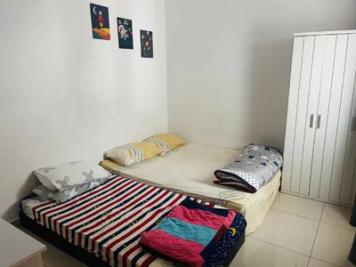 a small room with two bunk beds in it at NO 121 NAZIRIN HOMESTAY TMN DESA MANJUNG in Lumut