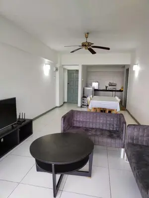 a living room with a couch and a table at Fraser Hill Silverpart Resort A3-1-1 Forest View With Lift in Bukit Fraser