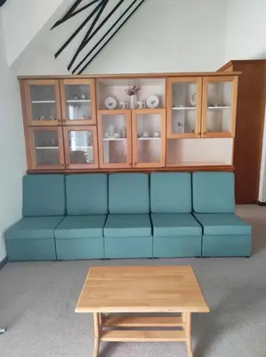a living room with a blue couch and a coffee table at Fraser Hill Silverpart Resort B2-6-1 Forest View High Floor No Lift in Bukit Fraser