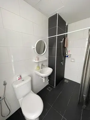 a bathroom with a toilet and a sink at R&C Guesthouse in Ipoh