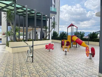 a playground in front of a building at R&C Guesthouse in Ipoh