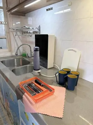 a kitchen with a sink and a cutting board on a counter at Fraser Hill Silverpart Resort A3-6-3A Best View With Lift in Bukit Fraser