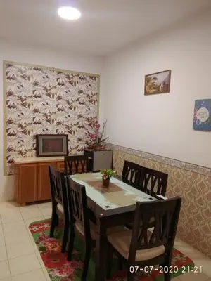a dining room with a table and chairs at Emily Homestay Cameron Highlands in Tanah Rata