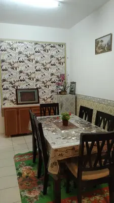 a dining room with a table and chairs at Emily Homestay Cameron Highlands in Tanah Rata