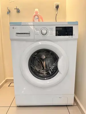 a white washing machine sitting in a room at Sunway Onsen Hotsprings with Theme Park View, Sunway Lost World in Ipoh