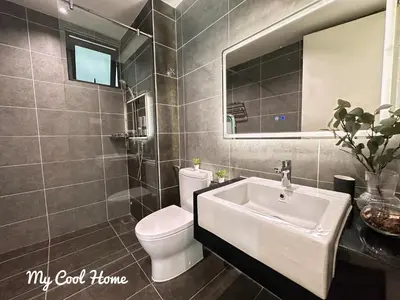 a bathroom with a sink and a toilet and a mirror at Sunway Onsen Hotsprings with Theme Park View, Sunway Lost World in Ipoh