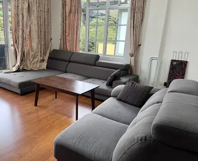 a living room with a couch and a coffee table at Cameron Crown Imperial Court @ Brinchang in Brinchang
