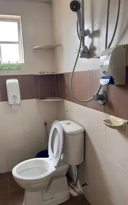 a bathroom with a toilet and a shower at Cameron Crown Imperial Court @ Brinchang in Brinchang