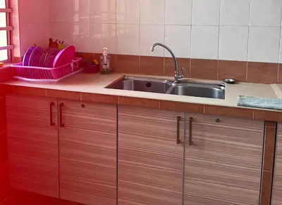 a kitchen with a sink and a counter top at Cameron Crown Imperial Court @ Brinchang in Brinchang