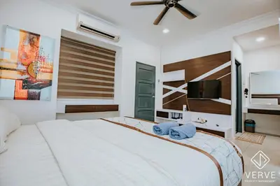a bedroom with a large bed with blue towels on it at Ipoh 27 Private Pool Villa By Verve EECH118 in Ipoh